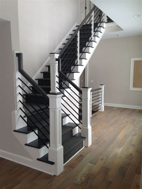 Anchored to floor same as temporary railing in order to minimize. . Black indoor stair railing